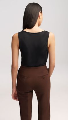 Designed to throw on and go, this straight fit tank top effortlessly falls along the body. Crafted from lightweight, silk fabric, its breezy shape and feel make it an essential layering item. Style with sophisticated suiting or tailored trousers and tees, depending on the mood you’re going for. Silk Charmeuse, Workout Tank Tops, Tailored Trousers, The Mood, Women's Tops, Silk Fabric, Layering, Trousers, Tank Top