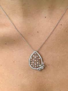 "Pacific Jewelry Key West Presents, All natural VS2 diamonds set in fine 18k white gold antique euro-style design. This pendant can be characterized as a chandelier style pendant for its rain like diamond droppings and carved gold flower that sits like a brooch near the wearer's heart. Message me for certificate of appraisal with order. <> ✔ 20 inch necklace included with order ✔ Gold Karat: 18K ✔ Diamond Weight: 1.82 carats total weight ✔ Diamond Color: G-I ✔ Cut: Round/Baguette/Fancy Cut Luxury Rose Cut Diamond Necklace In Platinum, Luxury Platinum Necklace With Rose Cut Diamonds, Luxury Diamond Pendant Necklace With Rose Cut, Luxury Rose Cut Diamond Pendant Necklace, Silver Briolette Diamond Necklace, Luxury Silver Briolette Diamond Necklace, Diamond White Platinum Necklace With Rose Cut Diamonds, Platinum Diamond Necklace With Rose Cut Diamonds, Exquisite Diamond Pendant Necklace