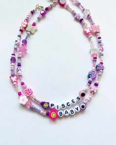 "Pink & Purple Beaded Name Necklace 🌸🍇 You will receive 1 necklace with a personalization (name/word) and length of your choice. Beaded by me with luuvvvv and will look similar to those pictured <3 Strung on strong cord with a mixture of glass, clay and plastic beads. Color scheme follows a pink and purple pattern! Beads are random and fun!! Silver or gold lobster clasp closure. Can also put little seed beads or a heart in between the letters/words, just let me know in the custom message box. Beaded Name Necklace, Pink Bead Necklace, Necklaces Beaded, Purple Beaded, Purple Bracelet, Rainbow Necklace, Rainbow Bracelet, Purple Pattern, Message Box