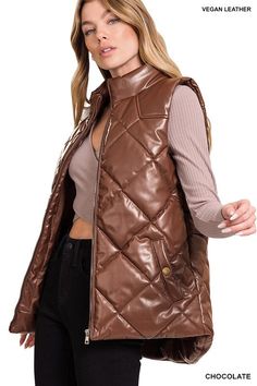 The Vegan Leather Puffer Vest is a fashion-forward choice that combines style and ethics. Crafted from cruelty-free vegan leather, it offers a chic and edgy look without harming animals. With its puffer design, this vest provides warmth and insulation, making it a versatile addition to your fall and winter wardrobe, perfect for layering over sweaters or long-sleeved tops for a trendy and cozy outfit. Style: Casual Print / Pattern: Quilted Silhouette: Vest Fit: Regular Embellishment: Side Pockets Leather Puffer Vest, Leather Puffer, Puff Vest, Quilted Puffer Vest, Puff Jacket, Outerwear Vest, Cozy Outfit, Edgy Look, Total Body