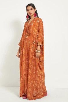 Orange natural crepe jumpsuit with ditsy polka print.
Component: 1
Pattern: Printed
Type Of Work: Ditsy polka print
Neckline: Lapel collar
Sleeve Type: Three quarter
Fabric: Natural Crepe
Color: Orange
Other Details: 
Concealed zip at the back
Concealed pocket
Shell and coin detailing
Attached lining
Occasion: Party - Aza Fashions Summer Bandhani Print Kaftan, Flared Jumpsuit, Crepe Jumpsuit, Jumpsuit For Women, Flare Jumpsuit, Jumpsuit Online, Lapel Collar, Aza Fashion, Three Quarter