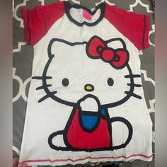 Size Large, But Seems Like Junior Large. Brand New Red Cotton Hello Kitty T-shirt, Red Hello Kitty Print Crew Neck Top, Red Crew Neck Top With Hello Kitty Print, Red Hello Kitty Short Sleeve Tops, White Short Sleeve Hello Kitty T-shirt, Red Cartoon Print Top For Spring, White Cotton Hello Kitty T-shirt, White Hello Kitty Cotton T-shirt, Casual Red Hello Kitty Top