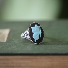 14 x 10mm cabochon on an antiqued sterling silver plated or brass adjustable ring. Easy to adjust to any size. Choose from Amber/Cream, Blue/White, Black/Blue or Black/Cream. Cameo Rings, Cameo Bracelet, Retro Ring, Cameo Jewelry, Cameo Ring, Snowflake Obsidian, Black Butterfly, Blue Ivory, Victorian Style