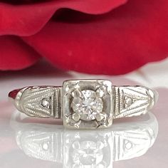 Details: Sweet classic Art Deco diamond ring--this one would make a great engagement ring or just a sweet ring to add to a collection. Would also be a great pinky ring! Please ask all necessary questions prior to placing an order. Measurements: The size is 4 1/2 US, and can be sized for a fee. Condition: The overall all condition of this ring is very good. Promise Diamond Ring With Single Emerald Cut Diamond, Promise Diamond Ring With Single Emerald Cut, Emerald Cut Diamond Promise Ring With Single Diamond, Classic Promise Rings With Round Band, Elegant Single Diamond Cluster Ring In White Gold, Heirloom Diamond Solitaire Jewelry, Classic Round Cut Cluster Ring For Promise, Heirloom Solitaire Ring With Classic Cut, Promise Cluster Ring With Diamond Cut Round Shape