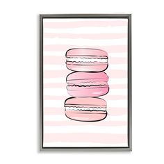 a pink and white poster with three donuts stacked on top of each other in front of a striped background