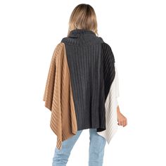 Introducing our Color Blocked Pleated Fleece Poncho, a chic and cozy addition to your winter wardrobe that beautifully combines comfort and style. A perfect addition to our Cozy Coat Collection. This poncho features an elegant color block design in timeless shades: beige, charcoal, black, and winter white. The clever use of these hues creates a striking visual appeal while allowing for versatile pairing with various outfits. Crafted from high-quality fleece, this poncho offers luxurious softness Cozy Color Block Outerwear For Winter, Cozy Color Block Winter Outerwear, Cozy Color Block Outerwear For Layering, Cozy Color Block Fall Outerwear, Cozy Brown Poncho For Layering, Fleece Poncho, Poncho Jacket, Capes & Ponchos, Cozy Coats