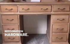 there is a wooden desk with drawers on it and the caption reads restoration hardware