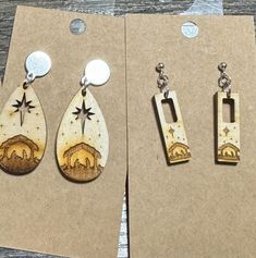 Experience the enchanting beauty of our handcrafted earrings featuring an engraved nativity scene, expertly designed in natural wood colors. Whether you prefer the elegant teardrop shape or the subtle charm of the small rectangle, each piece tells a story of warmth and love. The intricate engraving captures the essence of the nativity, making them a perfect accessory for holiday gatherings or everyday wear. Lightweight and durable, these earrings add a touch of artisan flair to any outfit while spreading kindness and joy wherever you go! Nativity Earrings, Spreading Kindness, Laser Cut Wood Crafts, Earrings Wood, The Nativity, Earrings Christmas, Wedding Jewelry Earrings, Handcrafted Earrings, Christmas Earrings