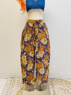 "Vintage Kantha Bohemian Trousers with Pockets, Upcycled Clothing, Boho Palazzo Pants, Hippie Style, 70s Outfit, Quilt Pants, Unique Pants These Vintage Kantha Bohemian Trousers with Pockets are stylish, handstitched trousers crafted with handmade Kantha fabric. They have a 70s-inspired palazzo style and come in an airy, loose fit for ultimate comfort. With two side pockets, these trousers are perfect for everyday use while still encompassing boho style, and they are sustainably crafted with cot Bohemian Floral Print Full-length Pants, Vintage Spring Festival Pants, Yellow Bohemian Floral Print Bottoms, Yellow Bohemian Bottoms With Floral Print, Yellow Bohemian Cotton Pants, Bohemian Cotton Pants With Floral Print, Yellow Cotton Bohemian Pants, Bohemian Cotton Floral Print Pants, Vintage Cotton Pants With Floral Print