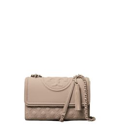 Directly from Tory Burch - The new Fleming. Bolder quilting and chain. Set against refined details and construction. Our shoulder bag is a matte design with diamond quilting and an embossed bombe Double T. The strap, now with a double shoulder guard for comfort, is braided with tonal chain. It's convertible, so you can wear it short or long. Tory Burch Official Site. Shoulder Guard, Miller Sandal, Sailor Pants, Super Dark, Cell Phone Wallet, Womens Designer Handbags, Casual Date, Designer Shoulder Bags, Diamond Quilt