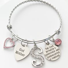 How could a Godmother not be touched with this sentimental keepsake.  Melt your godmother's heart today and bring a smile to her face, with this meaningful, timeless and elegant bracelet.  A special gift for godmother on baby's baptism or any special occasion, such as a Birthday, Christmas, Baptism, Valentines Day, Mother's Day, etc.   Our special Godmother bracelet comes gift boxed with a cleaning cloth and a beautiful velvet jewelry bag.  This makes it perfect for gift giving. JEWELRY DETAILS: Mother's Day Keepsake Jewelry With Hallmark, Inspirational Pink Jewelry For Gift, Inspirational Pink Jewelry For Gifts, Inspirational Hallmark Jewelry As A Gift For Mom, Silver Bracelets Keepsake For Mother's Day, Inspirational Hallmarked Jewelry For Mom, Inspirational Pink Jewelry For Mother's Day, Mother's Day Anniversary Charm Bracelet With Birthstone, Mother's Day Birthstone Charm Bracelet For Anniversary