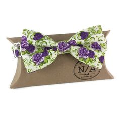 This floral bow tie is the perfect addition to any wardrobe. Fabric: New poly/cotton The strap is adjustable up to size XXL (19 1/2) and features metal hook, eye and slide hardware in nickel. All bow ties are shipped with a gift box. Dry clean or spot cleaning only. Please note that I try my very best to represent my bow ties as accurately as possible; however, the colour(s) of each bow may vary slightly depending your screen. Please don't hesitate to contact me if you have questions or would li Pre-tied Butterfly Knot Ties For Black Tie Events, Pre-tied Bow Tie With Butterfly Knot As Gift, Elegant Spring Bow Tie With Butterfly Knot, Classic Pre-tied Butterfly Knot Bow Tie, Floral Bow Tie, Hook Eye, Metal Hooks, Party Looks, Purple Floral