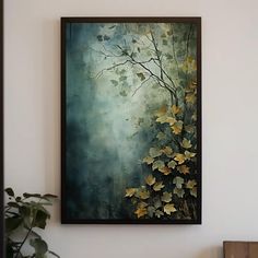 a painting hanging on the wall next to a potted plant