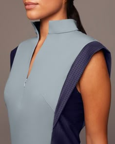 Designer's Notes PREORDER - Expected to ship on August 4th. Performance-engineered top with a sleek and boxy cut to define the shoulders and narrow-in on the waist line. Features an invisible front zipper to adjust the neckline collar as desired. Features Sweat wicking Two-way stretch Exceptional breathability Perforated insert shoulder band and side panel Stand collar with invisible zipper front Made with Love in Canada Size & Fit Slim - Streamlined to hug the body Modeled in size S Model Measu Multifunctional Clothing, Desired Features, Admiral Blue, Narrow Hips, Luxe Loungewear, Golf Dresses, Futuristic Fashion, Clothing Details, Golf Fashion