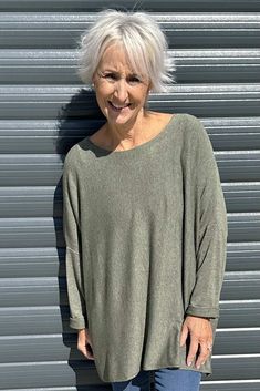 Your transitional wardrobe is here. The Made in Italy Lillian Jumper is a gorgeous lightweight knit that can be layered or added as an extra layer to take off the summer evening chill. Featuring a round neckline, rolled back sleeves and a lightweight knitted fabric. -Round neckline -Full length rolled back sleeves -Knitted fabric Oversized Fine Knit Crew Neck Top, Green Crew Neck Knit Top For Layering, Casual Soft Knit Batwing Sleeve Tops, Casual Soft Knit Top With Batwing Sleeves, Casual Soft Knit Tops With Batwing Sleeve, Oversized Batwing Sleeve Knit Top For Layering, Oversized Soft Knit Versatile Tops, Relaxed Fit Soft Knit Tops With Batwing Sleeves, Green Relaxed Fit Soft Knit Top