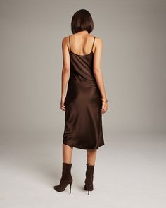 Bias cut Midi Slip Dress elegantly drapes on the body. This perfect basic can be worn for life, dressed up, or dressed down, for the perfect ensemble. Style with a sweater and boots in the Fall or wear with sandals in the Summer. 100% Silk Charmeuse Made in New York City Product Care: Dry Clean Only Elegant Brown Midi Dress For Night Out, Brown Fitted Slip Dress For Evening, Brown Fitted Slip Dress For Night Out, Chic Brown Viscose Dresses, Chic Fitted Brown Slip Dress, Fitted Brown Slip Dress For Evening, Fitted Brown Slip Dress For Night Out, Chic Brown Midi Dress For Night Out, Chic Knee-length Bias Cut Midi Dress