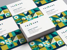 several business cards stacked on top of each other with the words travure printed on them