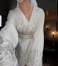 White Luxury Embroidered Wedding Dress - Bridal Gown with Intricate Details, Romantic Elegance, Handcrafted Beauty, Timeless Chic Elegant Floor-length Wedding Dress With Intricate Embroidery, Elegant Wedding Gown With Pearl Embroidery, Traditional V-neck Wedding Gown, Elegant Gown With Intricate Embroidery For Wedding, Elegant Embroidered Gown For Wedding, Elegant Embroidered Dresses For Ceremony, Elegant Wedding Dress With Intricate Embroidery, Ceremonial Gown With Pearl Embroidery, Long Sleeve Dresses With Intricate Embroidery For Wedding