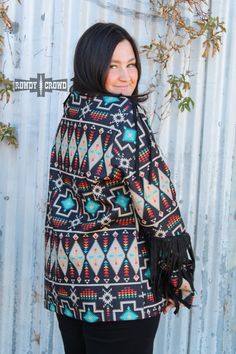 The Jolene Jacket is truly one of a kind with its bold Aztec print and fringe along the sleeves and shoulders. This jacket is lined with a comfortable material that is sure to keep you warm and stylish all season long. 90% Polyester & 10% Rayon Sizing chart in pictures. Casual Multicolor Fringe Outerwear, Casual Multicolor Fringed Outerwear, Winter Long Sleeve Outerwear With Tassels, Winter Outerwear With Tassels And Long Sleeves, Bohemian Fringe Outerwear For Fall, Fringe Long Sleeve Outerwear For Winter, Multicolor Fringe Winter Outerwear, Bohemian Fall Outerwear With Tassels, Multicolor Long Sleeve Outerwear With Tassels