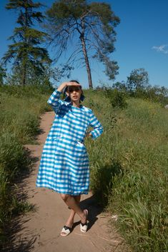 Part of a series of vintage inspired dresses, this deceptively simple blue and white gingham silk dress is a take on a 60s mod look, with a modern twist: pockets. Blue gingham silk featuring 3/4 sleeves and front pockets. Blue Plaid Dress For Spring Picnic, Blue Knee-length Plaid Dress For Spring, Blue Midi Dress For Picnic, Blue Knee-length Plaid Summer Dress, Blue Plaid Summer Midi Dress, Blue Plaid Midi Dress For Summer, Retro Blue Dress For Picnic, Gingham School Dress, Blue Checkered Dress