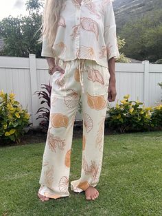 Get ready to turn heads with our Shell Game pant! These playful printed pants come with a matching top for a complete look. Featuring an elastic waist band with a tie, you'll have both style and comfort. (And no, this is not a game of deception - these pants are the real deal!) Casual Printed Pants For Vacation, Casual White Sets With Elastic Waistband, White Casual Sets With Elastic Waistband, Casual Sets With Straight Pants For Day Out, Casual Beach Pants With Matching Set, Casual Beach Pants Matching Set, Vacation Sets With Elastic Waistband And Wide Leg, Casual Vacation Sets With Straight Pants, Casual Printed Bottoms For Loungewear