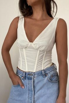 | V-Neck Corset Smocked Back Top | Self: 100% Polyester | Lining: 100% Cotton   * MODEL IS 5'7″ AND IS WEARING A SMALL Fitted V-neck Smocked Top With Ruched Detail, Ruched V-neck Smocked Top, White V-neck Tops With Smocked Back, Fitted Cotton V-neck Smocked Top, White V-neck Top With Smocked Back, Solid V-neck Top With Smocked Bodice, V-neck Top With Smocked Bodice, White V-neck Smocked Top With Smocked Back, White V-neck Smocked Top