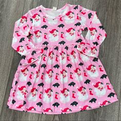 Girls Pink Christmas Dress With Santa Print. Pink Christmas Dress For Dress-up, Cute Long Sleeve Holiday Dress, Cute Long Sleeve Holiday Dress For Party, Cute Long Sleeve Festive Dresses, Cute Long Sleeve Holiday Party Dress, Playful Long Sleeve Christmas Dress, Cute Long Sleeve Holiday Dress For Festive Occasion, Cute Long Sleeve Festive Holiday Dress, Playful Long Sleeve Dresses For Sleepover