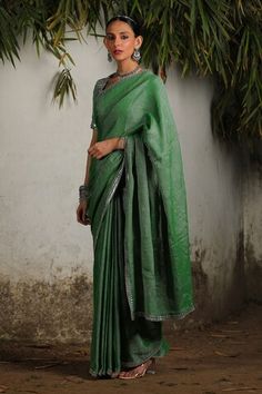 Green handwoven cotton zari saree with hand embroidered silver border. Comes with matching hand embroidered blouse and under skirt petticoat. - Aza Fashions Pre-draped Cutdana Saree For Rituals, Navratri Pre-draped Saree With Zari Work, Pre-draped Saree With Zari Work For Rituals, Navratri Rituals Pre-draped Saree With Zari Work, Green Saree For Rituals, Elegant Saree For Navratri Rituals, Cotton Pre-draped Saree For Wedding, Festive Green Saree For Rituals, Green Saree For Rituals And Festive Occasions