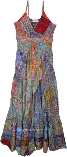 This effortlessly chic long long dress captivates with its vibrant colors of the patchwork in different prints. The flowy empire silhouette flatters all it's length, with a short smocked band on the back giving a top fit. #tlb #Printed #BohoDress #RetroDress Multicolor Mixed Print Maxi Dress For Summer, Summer Multicolor Maxi Dress With Mixed Print, Multicolor Paisley Print Maxi Dress, Flowy Multicolor Floral Patchwork Dress, Multicolor Maxi Dress With Mixed Print, Multicolor Flowy Dress With Floral Patchwork, Multicolor Floral Patchwork Maxi Dress For Vacation, Bohemian Dresses In Multicolor Mixed Print, Multicolor Bohemian Dress With Mixed Print