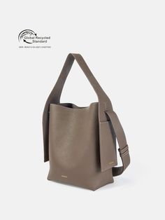 Learn about Songmont's recycled leather Drippy Tote Bags, your partner in your eco-friendly journey. Experience the magic of leather recycled from ocean waste. Modern Recyclable Bags For Everyday Use, Modern Everyday Recyclable Bags, Eco-friendly Everyday Bucket Bag With Top Handle, Eco-friendly Leather Shoulder Bag For Everyday, Recyclable Brown Tote Bag, Brown Recyclable Bags For Daily Use, Everyday Brown Recyclable Bag, Everyday Brown Recyclable Bags, Eco-friendly Brown Bucket Bag With Removable Pouch