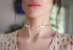 This beautiful choker is made out of an intricate and detailed swirls decorated with pearls, all soldered securely on each side, on a flexible and adjustable base. Measurements: The circumference is approximately 12 inch / 30 cm * Comes wrapped in a beautiful gift bag/box. * Available in 14k gold, rose gold or silver plated brass. For updates, new products, one-of-a-kind's, special offers and more- like us on Facebook: https://www.facebook.com/avigailadamjewellery Follow me on Instagram: https:/ White Metal Choker For Wedding, White Metal Wedding Choker, Adjustable Metal Pearl Necklace For Wedding, Vintage Metal Choker For Wedding, Vintage Pearl Chain Choker For Wedding, Gold Wedding Necklace, Bridal Jewelry Gold, Pearls Choker, Gold Necklace Wedding