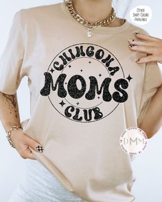 Chingona Moms Club Shirt - Black glitter graphic design. Glitter does not shed. *Sand Dune shirt displayed on main photo. Shirt is unisex, soft and TTS. If you would like a different glitter color than Black, see attached color chart and send as a note on the order at checkout. --------------------------------------------- PROCESSING TIME: 3-7 business days (M-F) before an item ships. If you need something sooner, please send a message before purchase. SIZING: A size chart is available in the photos. Unisex sizing - if you prefer a more fitted look, size down one from your normal women's sizing. CARE INSTRUCTIONS: Wash inside out. Hang to dry or tumble dry low. Do not iron on design. --------------------------------------------- MATERIAL: Solid Colors: 4.2 oz., 100% airlume combed and ring Crew Neck Cotton Shirt With Glitter Print, Cotton Crew Neck Shirt With Glitter Print, Cotton Glitter Short Sleeve Tops, Cotton Glitter Print T-shirt, Funny Spanish, Spanish Shirts, Shirt Display, Funny Mom Shirt, Glitter Design