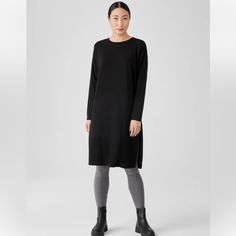 Nwt Eileen Fisher Stretch Jersey Knit Crew Neck Dress Boxy Fit, Calf Length Easy And Elevated. A Crew Neck Dress With Long Sleeves And Zippered Side Slits At The Hem. In A Body-Skimming Jersey Knit That Dresses Up Or Down. A Generous, Boxy Fit That Drapes Away From The Body To Create Movement. Tencel Lyocell Fiber Is Made From Responsibly Harvested Trees. We Design Our Line As A System Of Simple Shapes And Signature Fits So You Can Easily Find The Options That Work For You. Graphite Only Availab Black Viscose Long Sleeve Midi Dress, Black Long Sleeve Viscose Midi Dress, Long Sleeve Viscose Dresses For Loungewear, Black Long Sleeve Viscose Dress, Black Longline Daywear Dress, Black Longline Dress For Daywear, Black Stretch Viscose Dress, Fall Knee-length Dress With Side Slits, Longline Loungewear Dresses