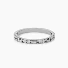 a white gold wedding band with five diamonds