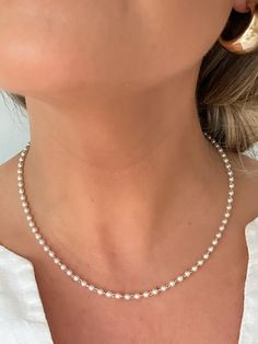 D E T A I L S - 18K Gold Filled, Synthetic Pearls - 16" length with a 2" extender - Lobster Clasp  M A T E R I A L S At Dylan Rae, we are committed to handcrafting jewelry that is perfect for everyday wear. Our high-quality gold filled designs contain 100+ times more real gold than gold plated components. The thick outer layer of gold makes it highly durable and safe for people with allergies or sensitive skin. C A R E Care for Your Gold Filled Jewelry: Wear It, Love It, Care for It! Our gold-fi Delicate Single Strand Bridal Necklace As Gift, Delicate White Single Strand Bridal Necklace, Dainty White Necklace For Bridesmaid Gift, Dainty White Pearl Necklace For Anniversary, White Pearl Charm Necklace For Bridesmaid Gift, White Pearl Charm Necklace For Bridesmaid, Silver Single Strand Bridal Necklace Gift, Dainty White Necklace For Anniversary, White Pearl Chain Jewelry For Bridesmaid Gift