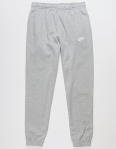 Nike Sportswear Club Fleece Sweatpants. Combines Classic Style With The Soft Comfort Of Fleece. Standard Fit Has A Relaxed, Easy Feel. Tapered Leg. Elastic Waistband. Side Pockets. Embroidered Logo On Left Leg. Elastic Cuffs. Fleece Lining. 80% Cotton 20% Polyester. Machine Wash. Imported. Grey Nike Sweatpants Outfits, Nike Sweatpants Outfit, Grey Nike Sweats, Nike Grey Sweatpants, Jogging Nike, Grey Nike Sweatpants, Sweatpants Nike, Nike Sportswear Club Fleece, Cute Sweatpants