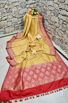 A stunning saree for amazing parties, available in golden yellow color with full-body having a traditional golden matte finish zari work in a paisley motif pattern with filigree style weaving on the pallu and the border makes this silk mark tanchoi double katan a must-buy. Color: A shade of golden yellow color Technique: Amazing work of golden antique finish zari work on the body in alternate arrangement with traditional weaving on the pallu and the border Fabric: Katan Silk Quality: Indyvogue's Assurance of Pure Silk Mark Certified Saree Paisley Motif, Border Fabric, Golden Yellow Color, Motif Pattern, Work Online, Color Techniques, Kinds Of Fabric, Katan Silk, Traditional Weaving