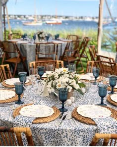 the table is set with blue and white dishes