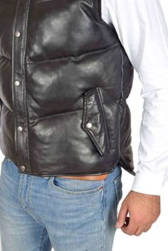 Men's Leather Puffer Vest In Black This men's leather puffer vest is a perfect combination of style and comfort. It has an outer shell made of real leather, while the inner visco-sheepskin layer provides ultimate warmth and durability. This vest features two side pockets with snap buttons, one inside pocket and its collar is turtle neck with zipper closure. Outer Shell: Real Leather Leather Type: Sheepskin Leather Finish: Semi-aniline Inner Shell: Viscose Lining Closure Style: Zipper With Snap B Leather Winter Outdoor Vest, Fitted Leather Winter Vest, Fitted Leather Vest For Winter, Leather Biker Vest For Winter, Leather Winter Vest With Pockets, Black Vest With Padded Collar, Black Casual Leather Vest, Casual Black Leather Vest, Luxury Black Vest For Fall