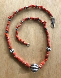 This exquisite coral and sterling silver beaded necklace is finished with an easy to clasp oversize sterling silver S -hook. 25 inch Artisan Beaded Necklaces With Sterling Silver Clasp, Unique Sterling Silver Necklaces With Large Beads, Unique Sterling Silver Necklace With Large Beads, Artisan Sterling Silver Necklace With Large Beads, Bohemian Beaded Necklace With Sterling Silver Clasp, Handmade Silver Beaded Necklaces With Red Coral, Silver Necklace With Polished Red Coral Beads, Artisan Coral Jewelry With Round Beads, Vintage Mediterranean