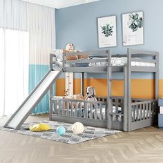 a child's bedroom with bunk beds and a slide