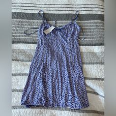 Nwt Urban Outfitters Floral Dress Size Medium Blue Blue Mini Dress From Urban Outfitters, Urban Outfitters Blue Mini Dress For Brunch, Blue Urban Outfitters Mini Dress For Brunch, Urban Outfitters Blue Casual Mini Dress, Spring Purple Mini Dress From Urban Outfitters, Urban Outfitters Purple Mini Dress For Spring, Urban Outfitters Blue Mini Dress For Vacation, Urban Outfitters Blue Sleeveless Mini Dress, Urban Outfitters Blue Mini Dress