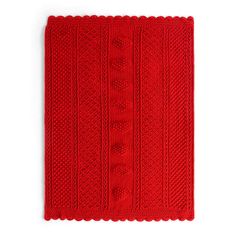 a red knitted dishcloth on a white background