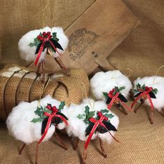 christmas decorations made out of cotton and holly