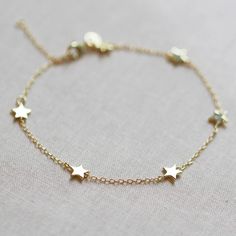 Our star bracelet is the perfect celestial addition to your bracelet stack. It features six tiny little stars that hang along delicate chain. DETAILS 6 inches long with 2 inch extender gold vermeil or .925 sterling silver Silver Star Bracelet, Stars Bracelet, Lunar Jewelry, Gold Bracelet Simple, Small Stars, Cheap Bracelets, Preppy Jewelry, Gold And Silver Bracelets, Jewelry Bracelets Gold