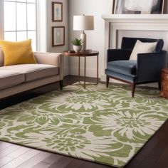 a living room filled with furniture and a rug on top of a hard wood floor