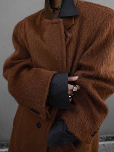 A classic alpine style long-sleeved oversized wool coat featuring a light and soft alpaca and wool blend. Warm and stylish item for the fall and winter seasons. Light, soft and warm with luxurious texture. Model is in MINUSEY ONE SIZE. ✔️ Free worldwide express shipping over $100✔️ Loved by 6,500+ customers✔️ Limited edition collections, maximum style⠀⠀⠀⠀⠀⠀⠀⠀⠀Stay ahead of the trend with can’t-find-anywhere-else staples. Your closet will thank you 💕 * MINUSEY ONE SIZE = EU 34-38, US 2-6* 45% Suri Alpaca Hair / 50% Wool / 5% Nylon* Dry clean* Made in Korea - Model Height: 172cm/5'7" (US2, EU34) Luxury Classic Lambswool Outerwear, Luxury Oversized Down Outerwear, Luxury Brown Casual Outerwear, Oversized Brown Wool Coat For Fall, Oversized Cozy Wool Coat For Winter, Cozy Oversized Wool Coat For Winter, Trendy Oversized Wool Outerwear, Oversized Brown Wool Outerwear, Oversized Brown Wool Coat