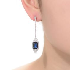 Dazzling with blue and white cubic zirconia gemstones, these sterling silver drop earrings lend an elegant touch to your wardrobe. Dazzling with blue and white cubic zirconia gemstones, these sterling silver drop earrings lend an elegant touch to your wardrobe. Length: 53 mm Backings: post Metal: sterling silver Plating: rhodium Finish: polished Packaging: boxedSTONE DETAILS Stone type: cubic zirconia Total weight: 9 5/8 ct. Shape: baguette cut, emerald cut, round Setting: bezel, prong Gemstones Blue Diamond Drop Earrings For Anniversary, Blue Diamond Drop Earrings For Formal Occasions, Blue Cubic Zirconia Diamond Earrings For Formal Events, Blue Diamond Drop Earrings, Classic Blue Diamond Drop Earrings, Blue Diamond Drop Earrings With Accents, Blue Diamond-accented Evening Earrings, Formal Sapphire Earrings With Sparkling Stones, Blue Diamond Earrings With Accents In Sterling Silver