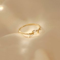 The Leaf Ring is an awesome integration of natural and modern style. The sparkling stones increase its brilliance. It is perfect for everyday wear and wonderful gift for all kind of occasions. - Made in 14k solid gold - Decorated with handset white cubic zirconia stone on 14k solid gold - Band Width: 0.99 mm / 0.038 inches - Thickness: 0,88 mm / 0.034 inches -This product comes with iconic Norm Jewels gift box Vine Wedding Band, Leaf Wedding Ring, Leaf Wedding Rings, Tiny Jewelry, Gold Leaf Rings, Vine Ring, Nature Inspired Rings, Luxury Jewelry Brands, Ring Marquise