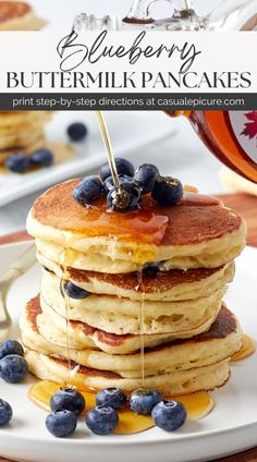 blueberry buttermilk pancakes on a plate with syrup